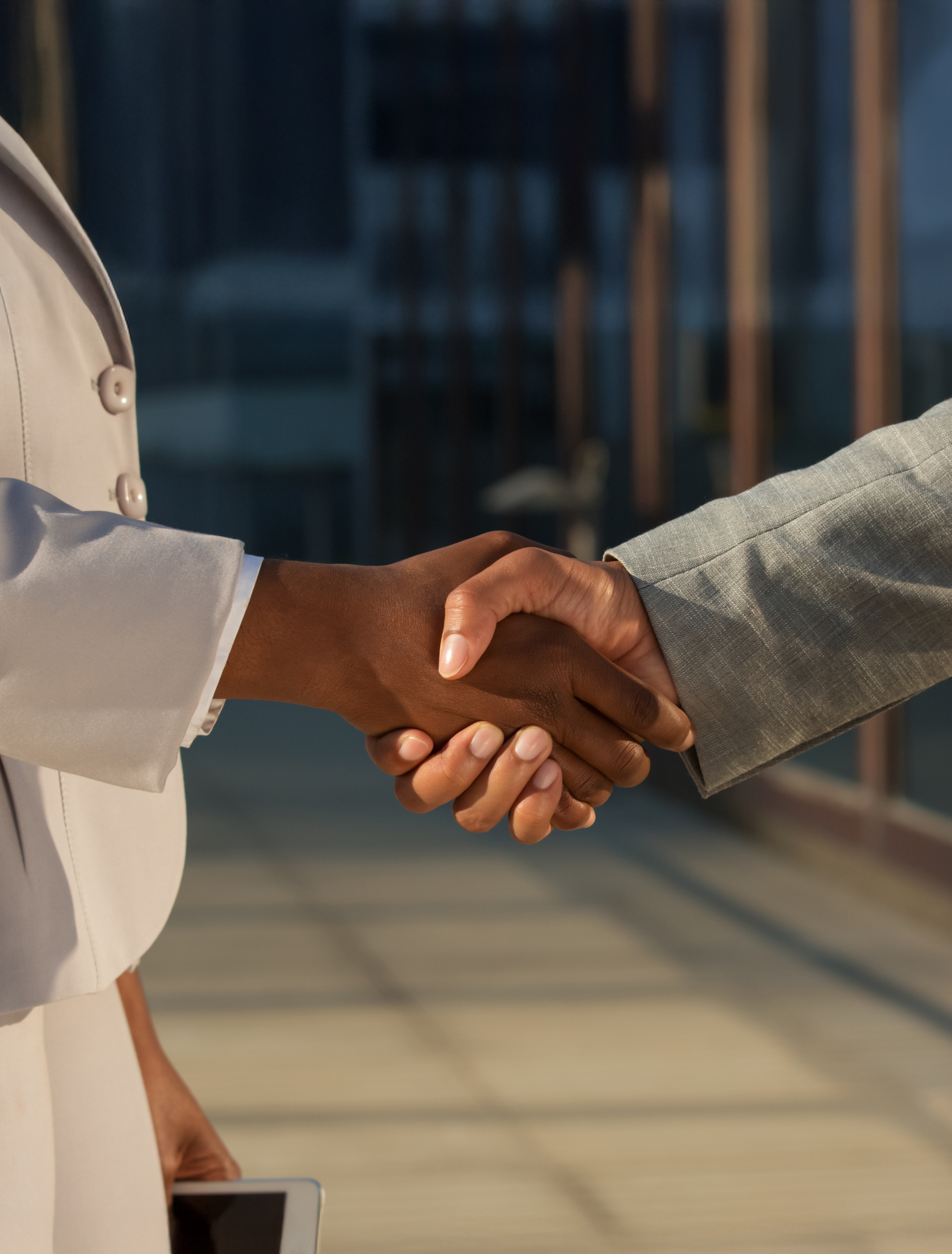 black-businesswoman-shaking-hands-with-male-partner